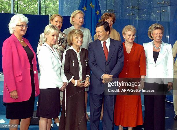 Incoming president-elect of the European Commission Portuguese Jose Manuel Barroso pose with women new commissioners for the official family...