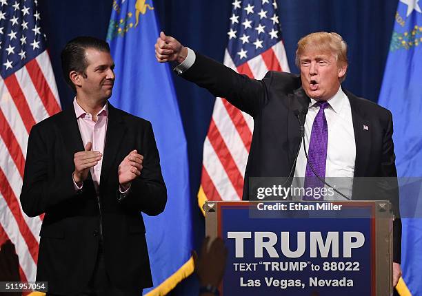 Donald Trump Jr. Looks on as his father, Republican presidential candidate Donald Trump, waves after speaking at a caucus night watch party at the...