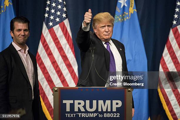 Donald Trump, president and chief executive of Trump Organization Inc. And 2016 Republican presidential candidate, right, gestures as his son Donald...