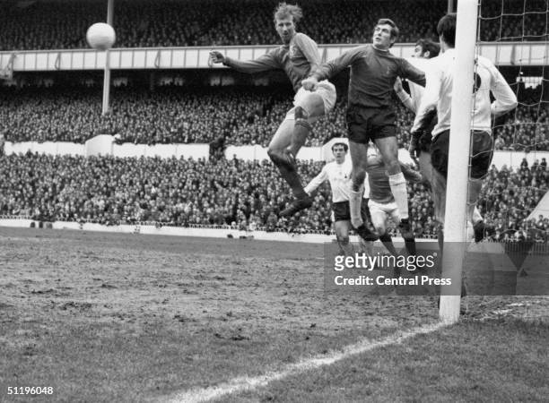 Spurs goalkeeper Pat Jennings punches away a header from Leeds centre half Jack Charlton during a game at Tottenham Hotspur's home ground White Hart...