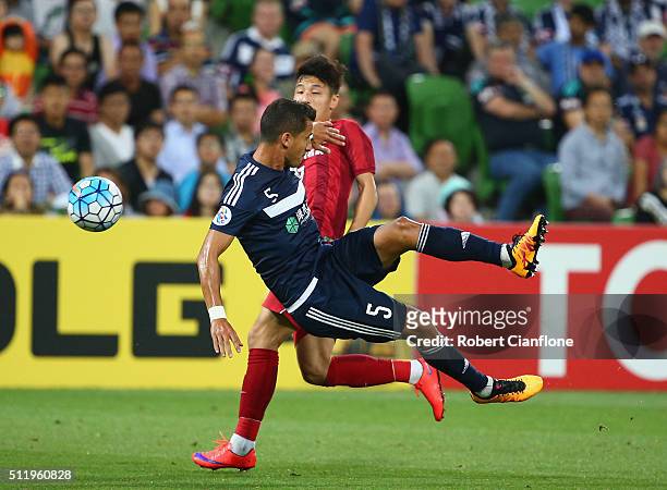 Daniel Georgievski of Melbourne Victory is challenged by Lei Wu of Shanghai SIPG during the AFC Asian Champions League match between Melbourne...
