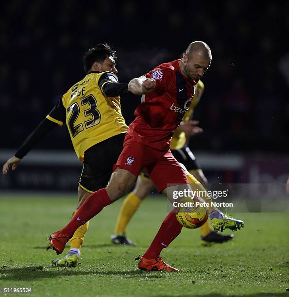 Russell Penn of York City contests the ball with Danny Rose of Northampton Town during the Sky Bet League Two match between York City and Northampton...