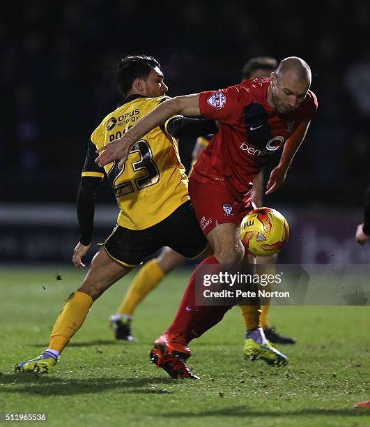 Russell Penn of York City contests the ball with Danny Rose of Northampton Town during the Sky Bet League Two match between York City and Northampton...