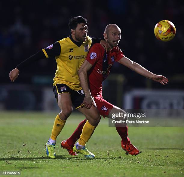 Russell Penn of York City contests the ball with Danny Rose of Northampton Town during the Sky Bet League Two match between York City and Northampton...