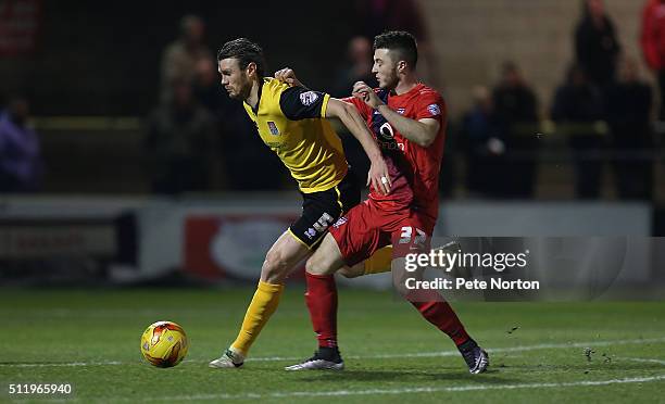 Zander Diamond of Northampton Town contests the ball with Bradley Frewster of York City during the Sky Bet League Two match between York City and...