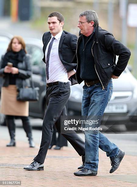 Footballer Adam Johnson arrives with his father Dave at Bradford Crown Court for day nine of the trial where he is facing child sexual assault...