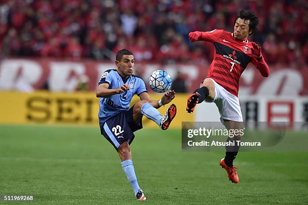 Ali Abbas of Sydney FC and Tsukasa Umesaki of Urawa Red Diamonds in action during the AFC Champions League Group H match between Urawa Red Diamonds...