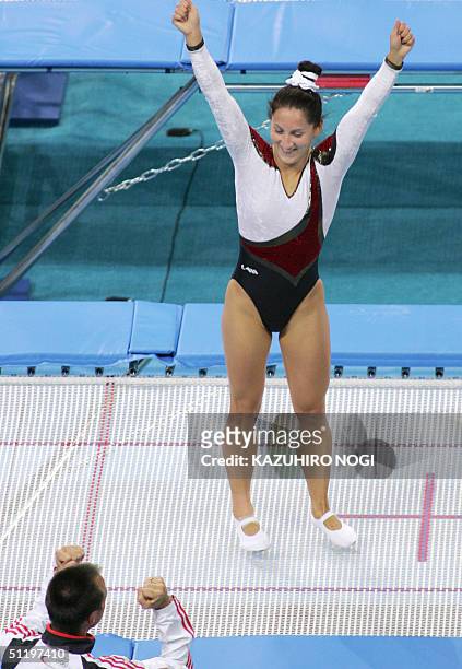 German Anna Dogonadze celebrates her victory in the women's trampoline final, 20 August 2004, at the Olympic Indoor Hall during the Athens 2004...