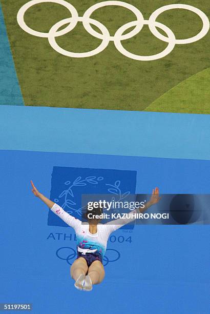 Haruka Hirota of Japan performs in the air during the women's trampoline qualification, 20 August 2004, at the Olympic Indoor Hall during the Athens...