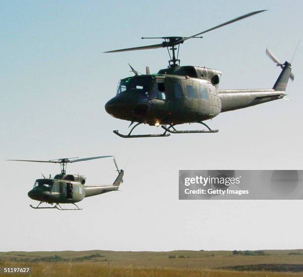 In this Air Force handout, Two UH1-N Huey heliopters fly over the prairie during a training exercise,August 19, 2004 in North Dakota.