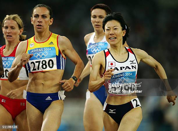Miho Sugimori of Japan and Maria Cioncan of Romania compete in the women's 800 metre event on August 20, 2004 during the Athens 2004 Summer Olympic...
