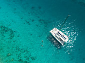 Aerial view of catamaran anchored in tropical Caribbean