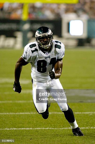 Terrell Owens of the Philadelphia Eagles runs down the field against the Baltimore Ravens on August 20, 2004 at Lincoln Financial Field in...