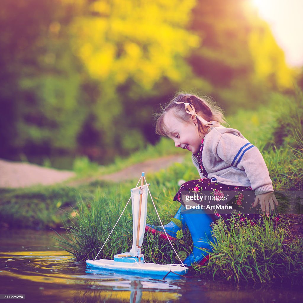 Child with toy ship