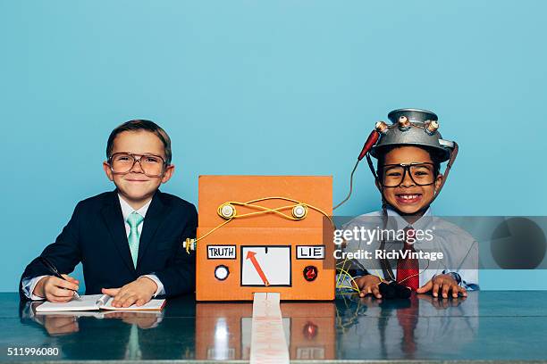 young honest businessman is tested with lie detector - nerd fun stock pictures, royalty-free photos & images