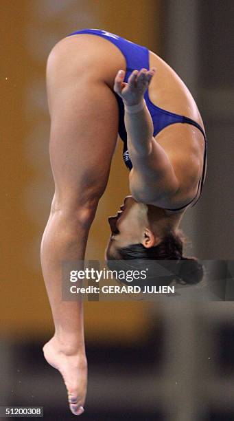 Australian women diver Loudy Tourky competes in the women's 10m platform semi-final, 21 August 2004, in the 2004 Olympic Games in Athens. AFP PHOTO...