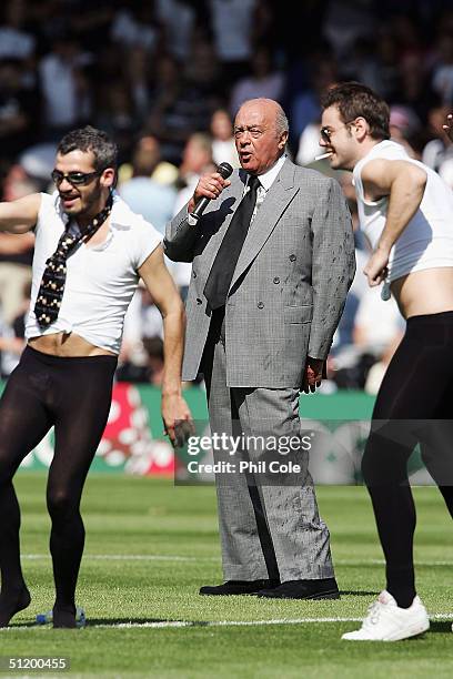 Wet Mohamed Al Fayed, Chairmen of Fulham, sings before the start of the Barclays Premiership match between Fulham and Bolton Wanderers at Craven...