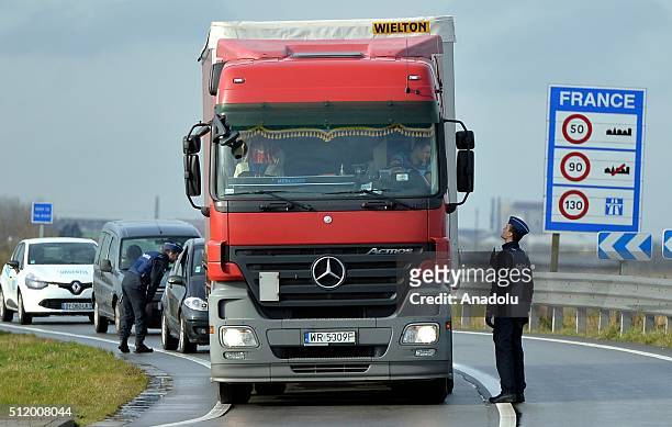 Belgian police check the vehicles to prevent refugee entrance into the country as vehicles cross the border from France into Belgium, in De Panne...