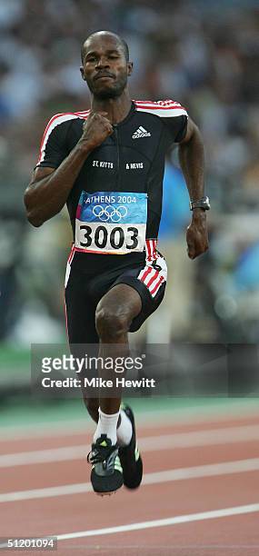 Kim Collins of Saint Kitts and Nevis competes in the men's 100 metre event on August 21, 2004 during the Athens 2004 Summer Olympic Games at the...