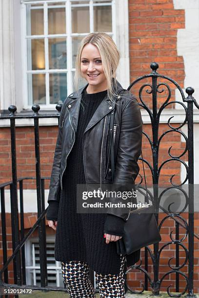Lyst senior fashion editor Kelly Agnew wears a Ganni sweater, H and M trousers, Acne Studios jacket and Celine bag on day 5 during London Fashion...