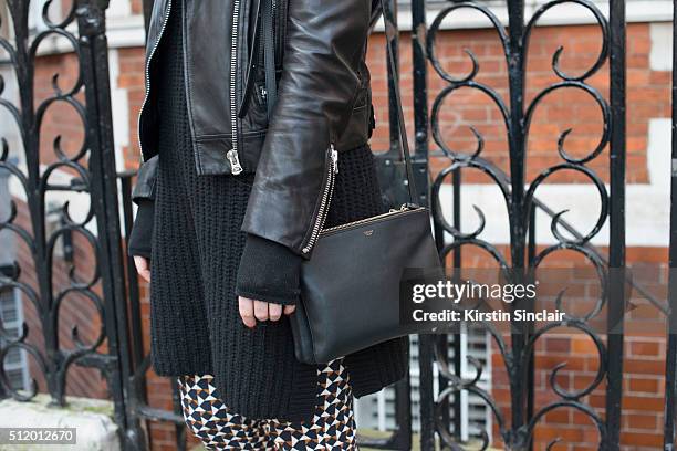 Lyst senior fashion editor Kelly Agnew wears a Ganni sweater, H and M trousers, Acne Studios jacket and Celine bag on day 5 during London Fashion...