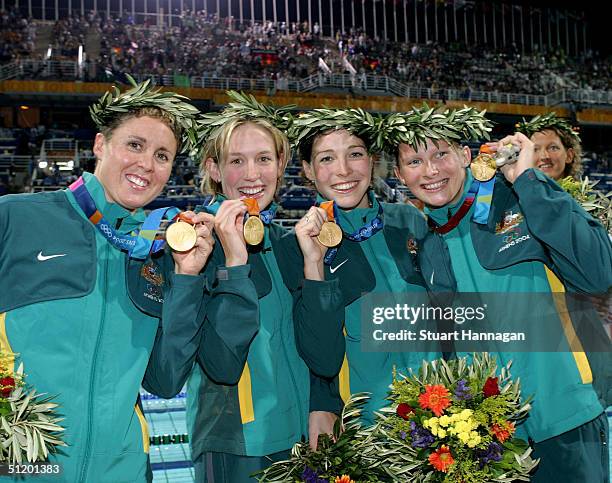 Pietra Thomas, Jodie Henry, Giaan Rooney and Leisel Jones of Australia win the gold medal for the women's swimming 4 x 100 metre medley relay event...