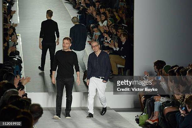 Designers Tommaso Aquilano and Roberto Rimondi acknowledge the applause of the audience after the Fay show during Milan Fashion Week Fall/Winter...