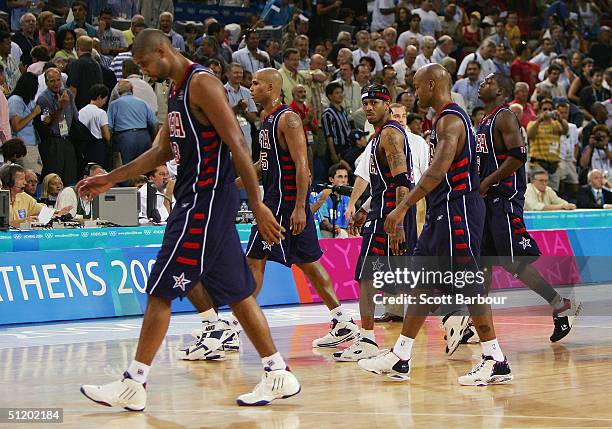 Tim Duncan, Richard Jefferson, Allen Iverson, Stephon Marbury anf Dwyane Wade of the United States walk off the court after a loss to Lithuania in a...