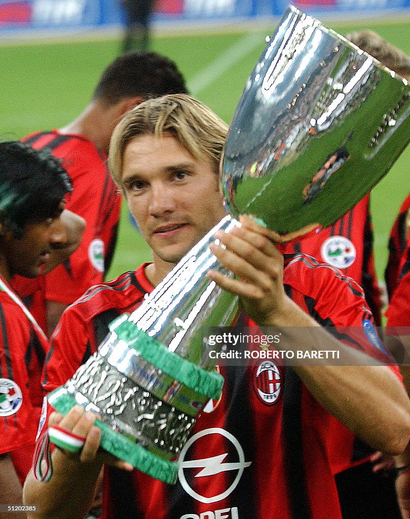 AC Milan Forward Andriy Shevchenko Of Ukraine Holds The Trophy After ac-milan-forward-andriy-shevchenko-of-ukraine-holds-the-trophy-after