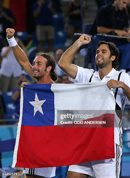 Chile's Fernando Gonzalez and Nicolas Massu celebrate after defeating Germany's Rainer Schuettler and Nicolas Kiefer in Olympic Games men's tennis...