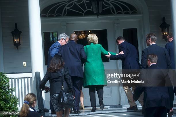 Democratic Presidential candidate, former Secretary of State Hillary Clinton slips as she walks up the stairs into the non-profit SC Strong, a 2 year...