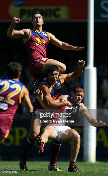 Daniel Bradshaw for the Lions leaps over the pack during the round twenty one AFL match between The Brisbane Lions and the St. Kilda Saints at The...