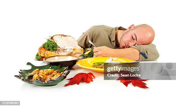 man falling asleep after dinner - thanksgiving leftovers 個照片及圖片檔