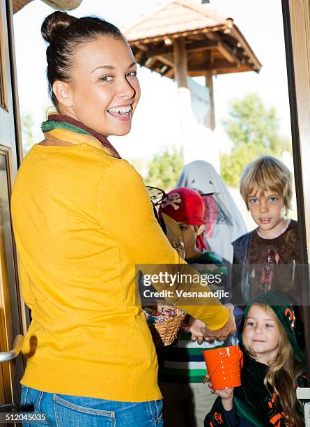 Out Getting Candy Handing Out Candy Halloween Photos and Premium High Res Pictures ...