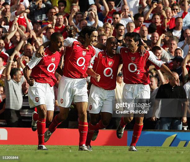 Arsenal players Gilberto, Robert Pires, Ashley Cole and Jose Antonio Reyes celebrate Pires' goal during the Barclays Premiership match between...