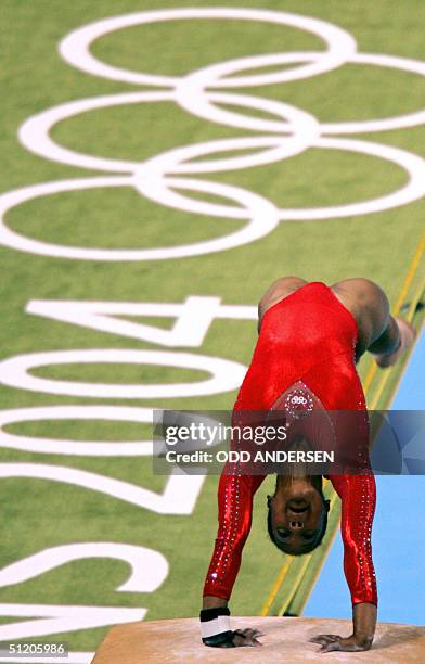Annia Hatch performs to win the silver medal in the women's vault final 22 August 2004 at the Olympic Indoor Hall in Athens during the Olympics...