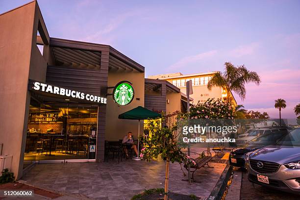 man drinking coffee in starbucks, la jolla, usa - starbucks stock pictures, royalty-free photos & images