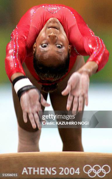 Annia Hatch performs to win the silver medal in the women's vault final 22 August 2004 at the Olympic Indoor Hall in Athens during the Olympics...