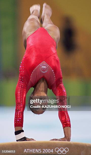 Annia Hatch performs to win the silver medal in the women's vault final 22 August 2004 at the Olympic Indoor Hall in Athens during the Olympics...