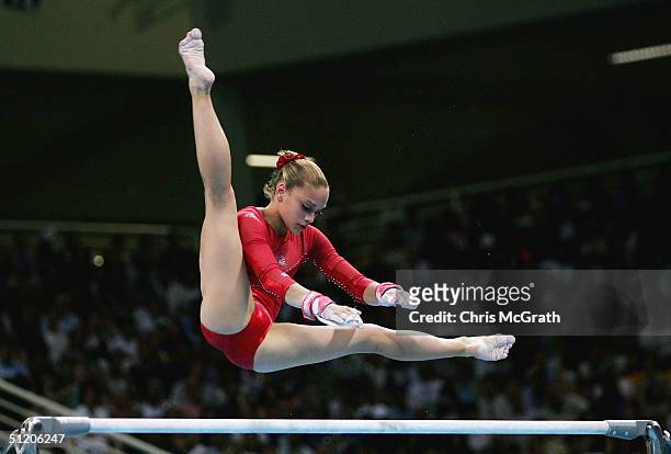 Terin Humphrey of the USA competes in the women's artistic gymnastics uneven bar finals on August 22, 2004 during the Athens 2004 Summer Olympic...