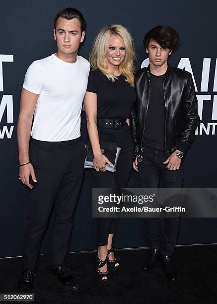 Actress Pamela Anderson, sons Brandon Thomas Lee and Dylan Jagger Lee arrive at SAINT LAURENT At The Palladium at Hollywood Palladium on February 10,...