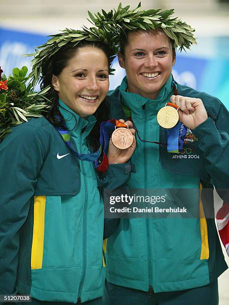 Loudy Tourky of Australia and Chantelle Newbery of Australia display their medals for the women's diving 10 metre platform event on August 22, 2004...