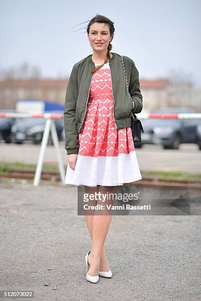 Carlotta Rubaltelli poses wearing a Kiabi bomber jacket and An Italian Theory dress before the Gucci show during the Milan Fashion Week Fall/Winter...