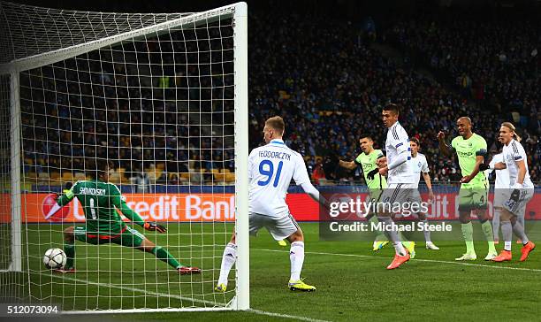 Sergio Aguero of Manchester City scores the opening goal past goalkeeper Oleksandr Shovkovskiy of Dynamo Kiev during the UEFA Champions League round...