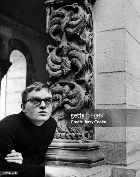 American author and celebrity Truman Capote leans on a stone block near an ornately carved column, 1947. His first novel, 'Other Voices, Other...