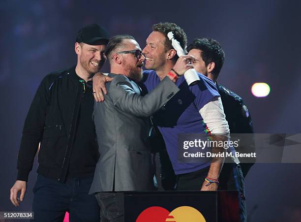 Chris Martin accepts the British Group award on behalf of Coldplay at the BRIT Awards 2016 at The O2 Arena on February 24, 2016 in London, England.