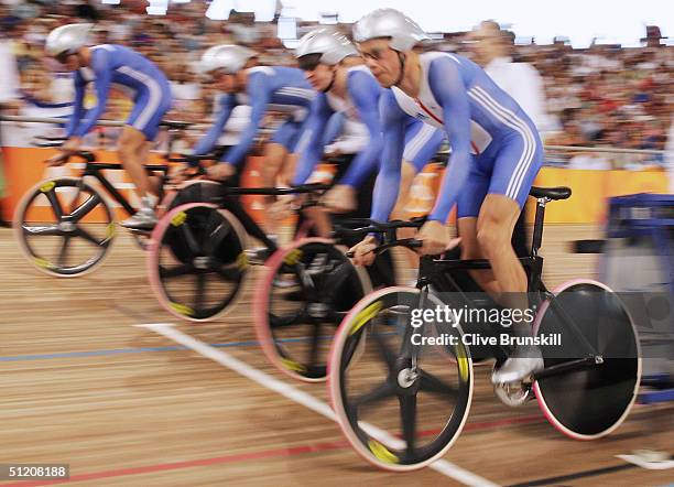 Steve Cummings, Paul Manning, Chris Newton, Bradley Wiggins of team Great Britain prepare take off from the starting blocks before finishing second...