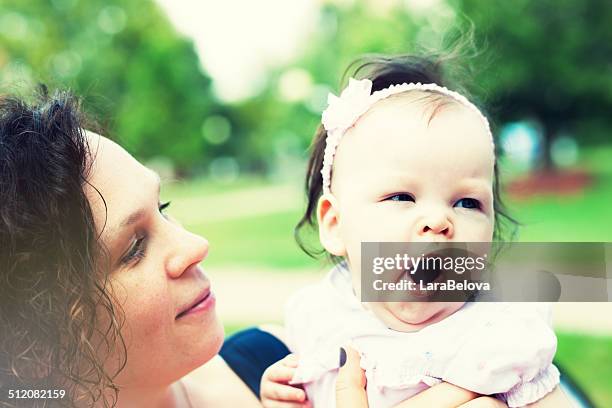 mother with baby daughter - yawning mother child stock pictures, royalty-free photos & images