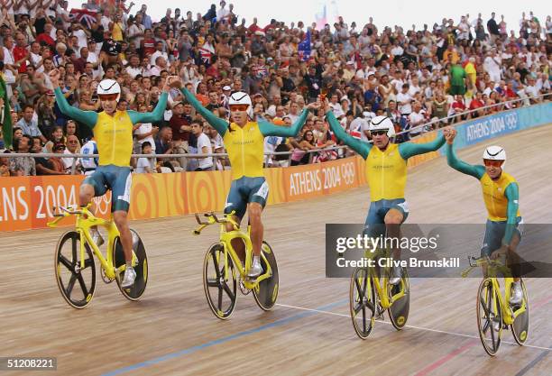 Graeme Brown, Brett Lancaster, Brad McGee and Luke Roberts of team Australia celebrate after winning the gold in the men's track cycling team pursuit...