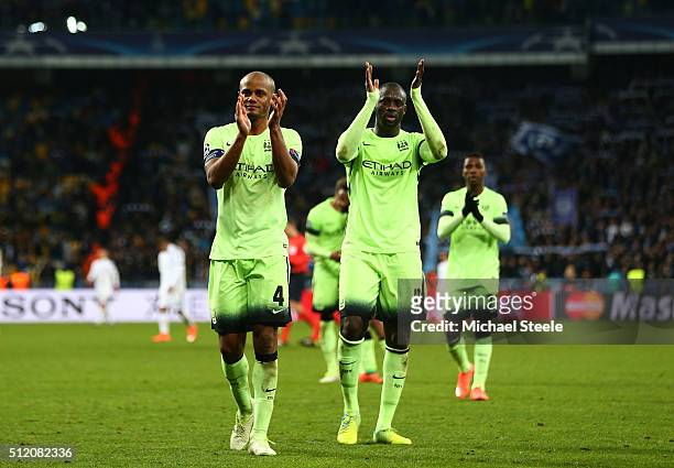 Vincent Kompany and Yaya Toure of Manchester City applaud the travelling fans following their team's 3-1 victory during the UEFA Champions League...